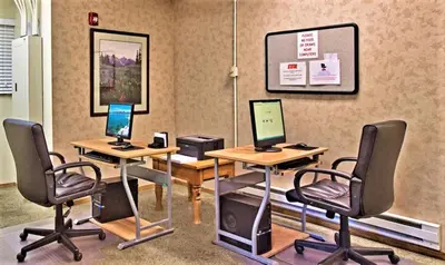 a room with two desks with computers on them at The Tahoe Beach & Ski Club Owners Association in South Lake Tahoe