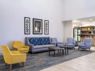 a waiting room with a couch and chairs at Holiday Inn Express Lodi by IHG in Lodi