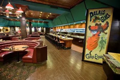 a restaurant with a bunch of tables and chairs at Carson Valley Motor Lodge and Suites in Minden