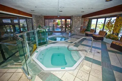 a large room with a jacuzzi tub in a house at Carson Valley Motor Lodge and Suites in Minden
