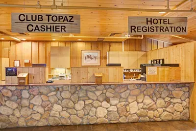 a hotel lobby with a hotel cashier and a hotel restaurant at Topaz Lodge in Gardnerville