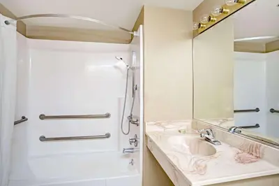 a bathroom with a sink and a mirror at Topaz Lodge in Gardnerville