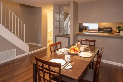 a kitchen and dining room with a table and chairs at Thunderbird Resort Club in Reno
