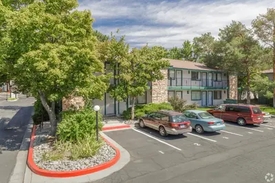 a couple of cars parked in a parking lot at Thunderbird Resort Club in Reno