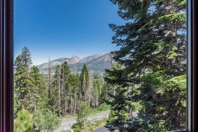 a view from a window of a road in a forest at Bridges Townhome #11 Townhouse in Mammoth Lakes