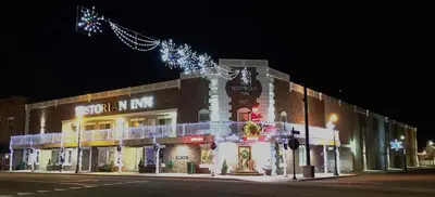 a building with christmas lights on the side of it at Historian Inn in Gardnerville