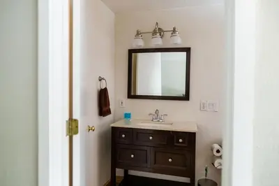a bathroom with a sink and a mirror at The Washoe Lodge in South Lake Tahoe