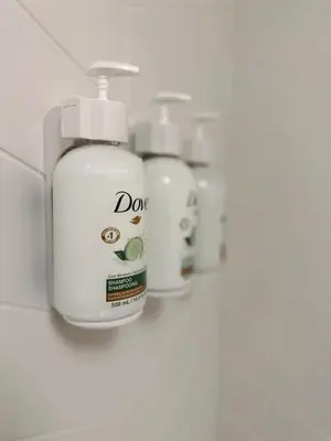 a group of white bottles ofodorizers on a counter at Ramada by Wyndham Merced in Merced