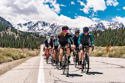 a group of people riding bikes down a road at La Vista Blanc #61 Condo in Mammoth Lakes