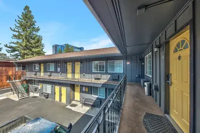 a balcony of a building with a yellow door at Lake Ridge South Lake Tahoe in South Lake Tahoe