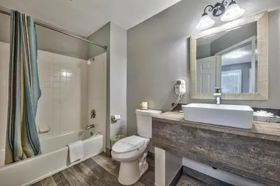 a bathroom with a sink and a toilet and a mirror at Lake Ridge South Lake Tahoe in South Lake Tahoe