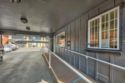 an empty building with a railing on the side of it at Lake Ridge South Lake Tahoe in South Lake Tahoe