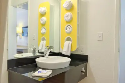 a bathroom with a sink and a mirror at Motel 6 - Santa Nella, on i-5 in Santa Nella Village