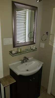 a bathroom with a sink and a mirror at Gondola Lodge & Tahoe Beach Club in South Lake Tahoe