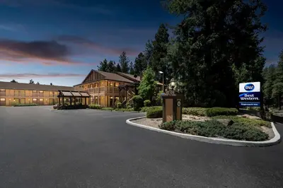 a hotel with a sign in front of a building at Best Western Stagecoach Inn in Pollock Pines