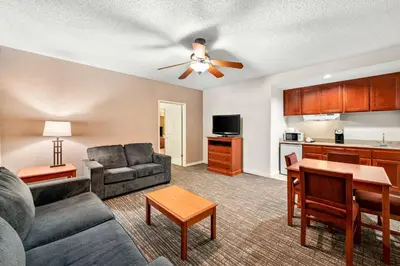 a living room with a couch and a table at Best Western Stagecoach Inn in Pollock Pines