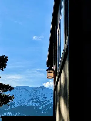 a window on a building with a view of mountains at Sierra Meadows Ranch in Mammoth Lakes