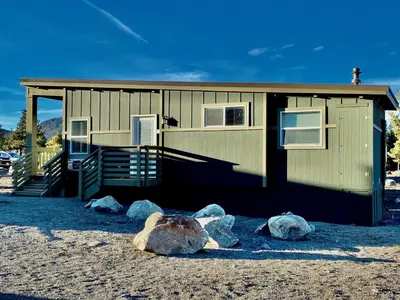 a building with three large rocks in front of it at Sierra Meadows Ranch in Mammoth Lakes