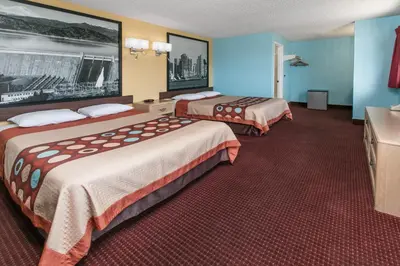 a hotel room with two beds in a room at Super 8 by Wyndham Bishop in Bishop
