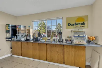 a restaurant with a counter with a display of food at Days Inn by Wyndham Carson City in Carson City