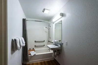 a bathroom with a sink and a mirror at Motel 6-Sparks, NV - Airport - Sparks in Reno