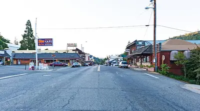 an empty street in a small town with buildings at The Monarch Inn in Mariposa