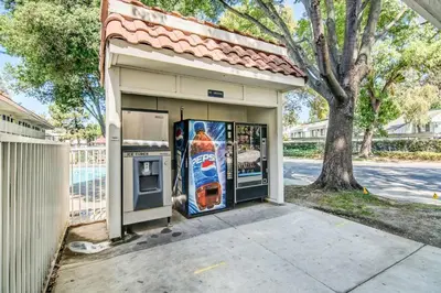 a gas station with a drink advertisement in the door at Motel 6-Stockton, CA - North in Lincoln Village