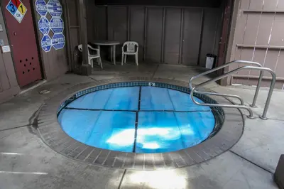 a small pool in a room with a table and chairs at Sierra Manors 8 Townhouse in Mammoth Lakes