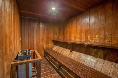 an empty wooden room with a bench in it at Courchevel 14 Condo in Mammoth Lakes