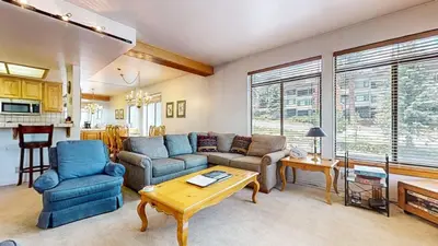 a living room with a couch and chairs and a table at Silver Bear 18 Condo in Mammoth Lakes