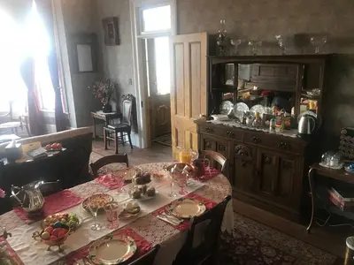 a dining room with a table with food on it at B Street House Inn in Virginia City