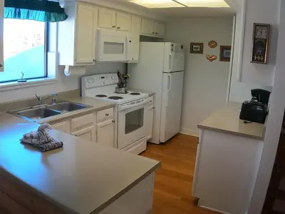 a kitchen with white appliances and a white refrigerator at Rr-edgewater08 in June Lake