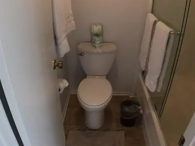 a small bathroom with a toilet and towels at Rr-edgewater08 in June Lake