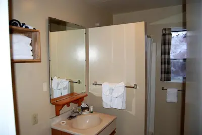 a bathroom with a sink and a mirror at Edelweiss Lodge in Mammoth Lakes