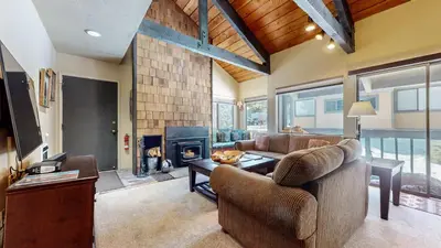 a living room with a couch and a fireplace at Bigwood #62 Condo in Mammoth Lakes