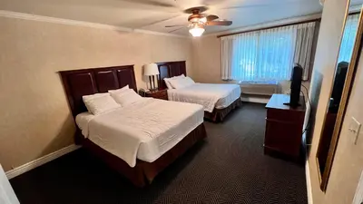 a hotel room with two beds and a window at Yosemite View Lodge in El Portal
