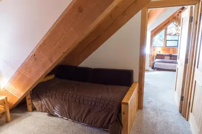 a bedroom with a bed in the attic at 824 Beaver Pond in Truckee