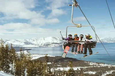 a group of four people riding a ski lift at Zalanta 328 - HVH3 in South Lake Tahoe