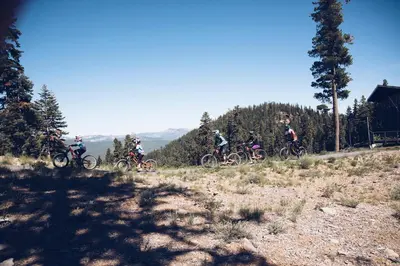 a group of people riding bikes on a hill at Ski Trails 4024 in Truckee
