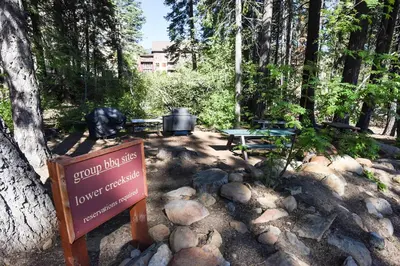 a sign in the middle of a park with a picnic table at Ski Trails 4070 in Truckee
