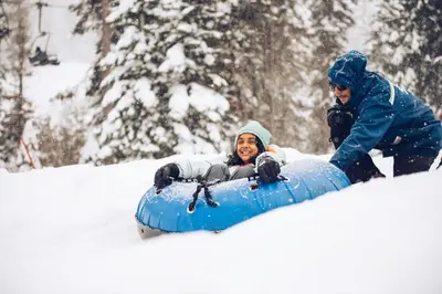 a man is riding on a snowboard in the snow at Ski Trails 4113 in Truckee