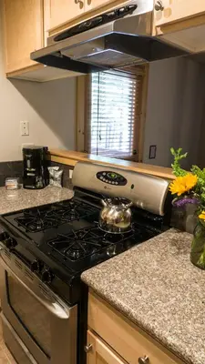 a kitchen with a stove top oven in a kitchen at Ski Trails 4113 in Truckee