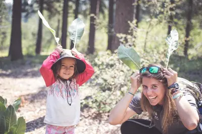 a woman and a little girl wearing leaves on their hats at Northstar Village 237 in Truckee