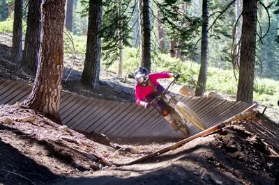 a person on a bike jumping over a fence at Northstar Village 237 in Truckee