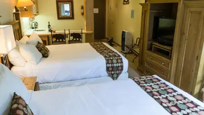 a hotel room with two beds and a flat screen tv at Northstar Village 237 in Truckee