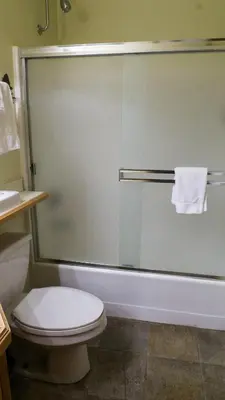a bathroom with a shower with a toilet and a sink at Northstar Village 237 in Truckee