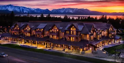 an aerial view of a large house with mountains in the background at Zalanta 221 in South Lake Tahoe