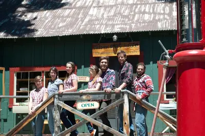 a group of people standing on top of a fence at Silver City Mountain Resort in Sequoia National Park