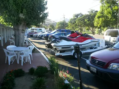 a row of boats parked in a parking lot at Mount-N-Lake Motel in Wofford Heights