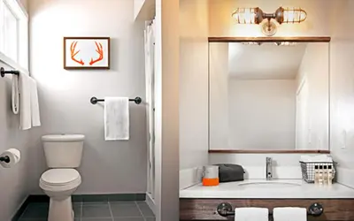 a bathroom with a toilet and a sink at Basecamp Tahoe South in South Lake Tahoe